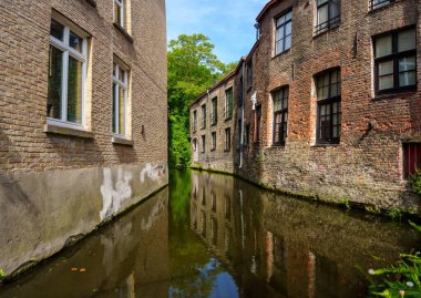 The canal is surrounded by colorful buildings, creating a picturesque and charming scene. It is a popular tourist destination and a great place to take a stroll and enjoy the scenery. clipart