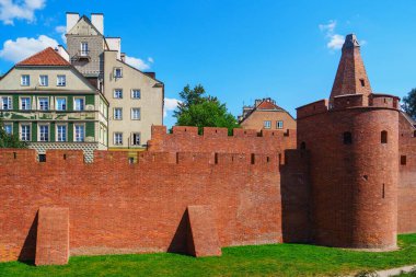 The Barbican in Warsaw is a fortified outpost that was part of the citys defenses in the 16th century. Today, it is a popular tourist destination offrant stunning city views. clipart