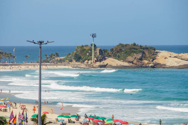 Ipanema beach in Rio de Janeiro, Brazil - October 25, 2022: Ipanema beach full in a beautiful sunny day in Rio de Janeiro.