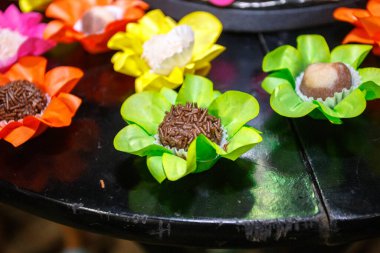 Party sweets on a black table in Rio de Janeiro.