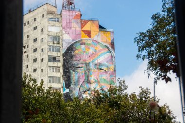 Graffiti with the face of Oscar Niemeyer, produced by graffiti artist Kobra, in Sao Paulo, Brazil - December 30, 2022: Graffiti on a building on Avenida Paulista with the face of architect Oscar Niemeyer.