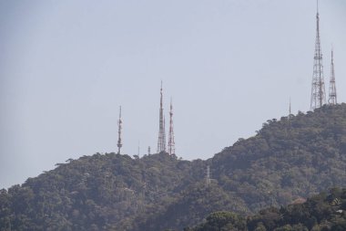 Sumare antennas seen from the Rodrigo de Freitas lagoon in Rio de Janeiro, Brazil. clipart