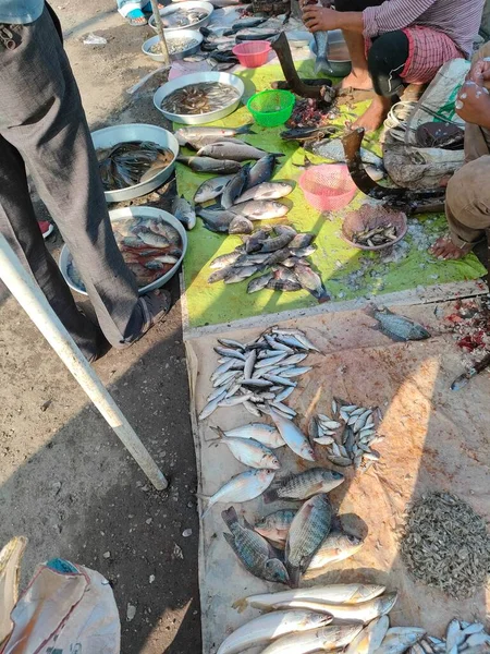 stock image fish market in west bengal with sellers cutting fish