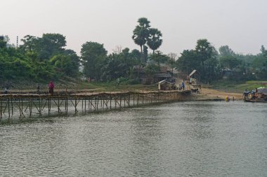 12.11.2022. Raiganj,West Bengal,India. Bamboo made lightweight bridge made over river in india.