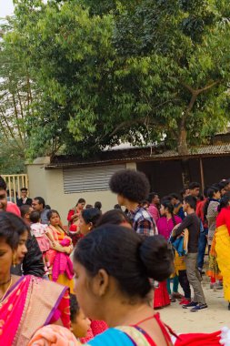 25.12.2022. a tall native asian man with curly hair standing in fair.