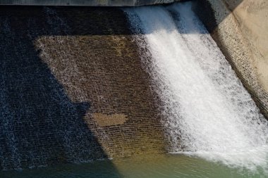 river dam controlling the flow of water through lock gates