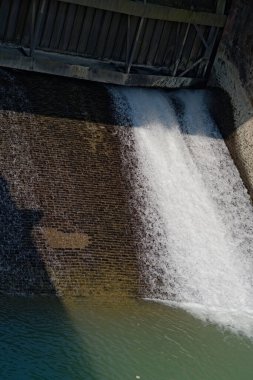 river dam controlling the flow of water through lock gates