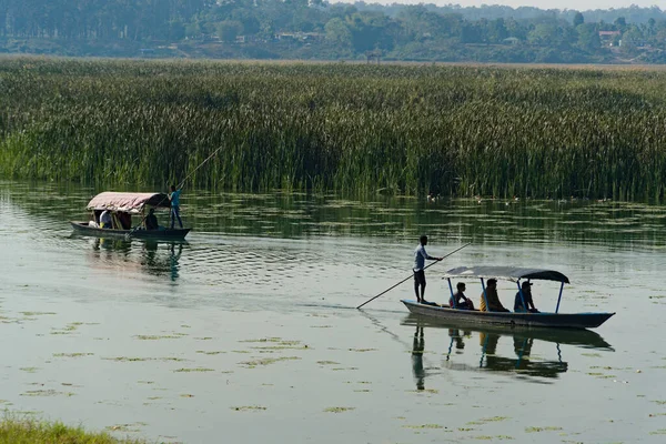 stock image tourists enjoying boat ride in a lake