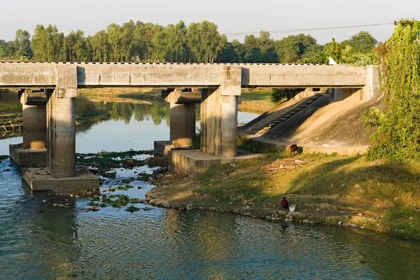 stock image 20.11.2022.india . west bengal. asia. . person fishing beside river bank in india.