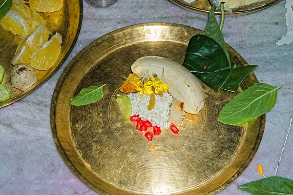 stock image different varieties of fruit offerings during hindu puja festival in a metal plate