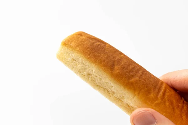白色背景上涂有黄油的面包棒 — 图库照片
