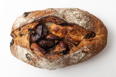 Beyaz arka planda incirleri olan acı verici bir kamp eşyası.