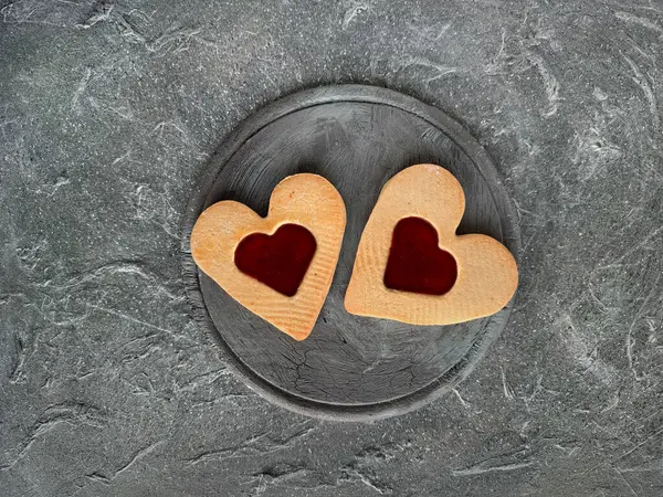 Two Large Heart Shaped Jam Cookies Board Grey Textured Background — Stock Photo, Image