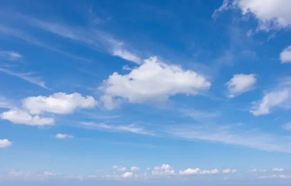 Blue Sky Filled Clouds Creating Dramatic Expansive View Stock Photo