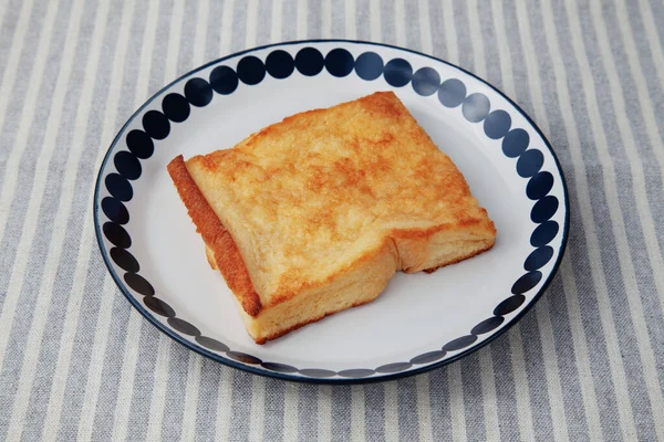french toast on plate closeup isolated on table