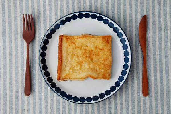 french toast on plate closeup isolated on table