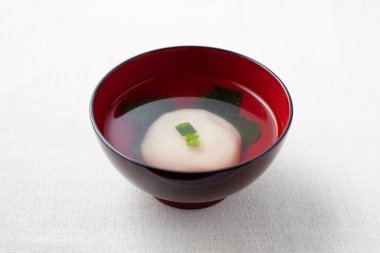 ozoni Japanese traditional rice cake soup isolated on table clipart