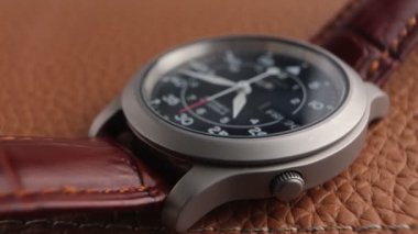 Close up of a fully automatic military watch with ticking hands