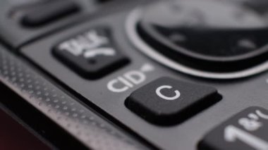 Modern residential cordless button phone with a digital display and clicky buttons