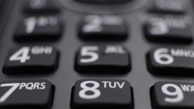 Modern residential cordless button phone with a digital display and clicky buttons