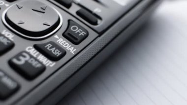 Modern residential cordless button phone with a digital display and clicky buttons