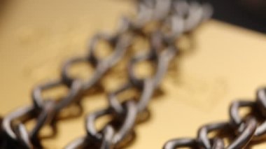 Close up of metal chain links conveying the message of power or entrapment