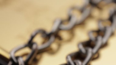 Close up of metal chain links conveying the message of power or entrapment