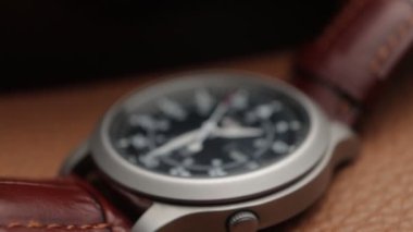 Close up of a fully automatic military watch with ticking hands