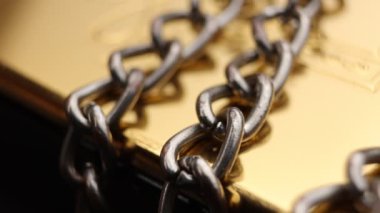 Close up of metal chain links conveying the message of power or entrapment