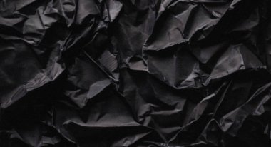 Buruşmuş siyah ambalaj kağıdı soyut arkaplan dokusu