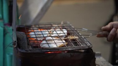 Seller Preparing Dry Squids For Grilling On Street Side Of Thailand Snack Famous Street Food With Charcoal Roast
