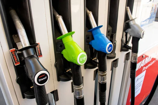 Sydney, Australia 2022-10-29 Petrol pumps hoses on Ampol petrol station. Fuel nozzles oil dispensers. Petrol diesel fuel prices .
