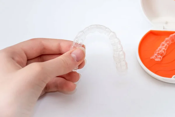 stock image Transparent aligners retainers in a storage case. Invisible braces. Clear teeth straighteners. Plastic bracers