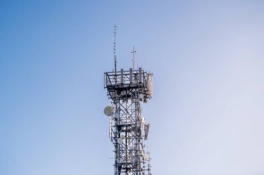 Radio, communication and cell tower on blue sky background in Australia