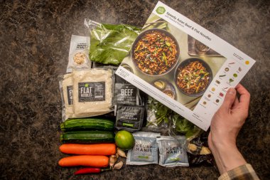 Sydney, Australia 2020-05-16 Hello Fresh meal kits: Speedy Asian beef and flat noodles on a kitchen countertop. clipart