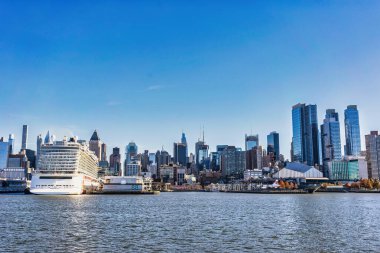 Manhattan, New York - November 26 2022: view of Manhattan skyline from Hudson river,New York. Manhattan has been described as the cultural, financial, media, and entertainment capital of the world