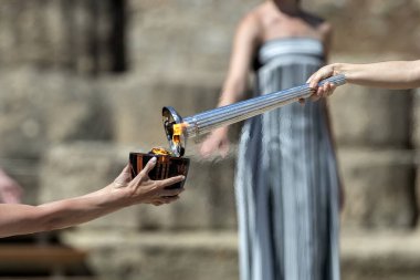 Olympia, Greece - April 15, 2024: Final dress rehearsal of the Olympic flame lighting ceremony for the Paris 2024 Summer Olympic Games in Ancient Olympia, Greece clipart