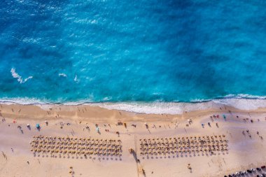 Myrtos Beach in Kefalonia is a breathtaking coastal destination known for its stunning turquoise waters, white pebbles, and steep cliffs. This iconic beach offers a serene setting ideal for swimming and relaxation clipart