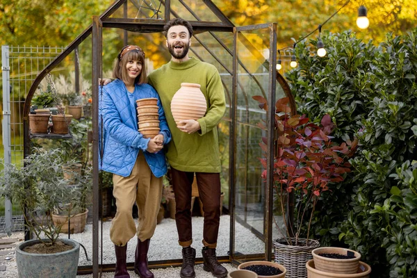 Portrait Young Couple Stand Together Clay Jugs Small Greenhouse Growing — Stock Photo, Image