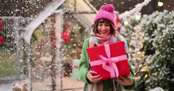 Young Woman Anticipation Holiday Holds Shakes Gift Box Beautifully Decorated — Stock Video