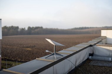 LVIV, UKRAINE - January, 2023: Starlink satellite dish, internet constellation operated by SpaceX, installed on roof of residential building on sunny day