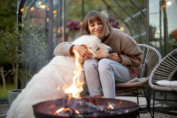 Young Woman Spends Evening Time Her Cute White Dog Sitting Royalty Free Stock Photos
