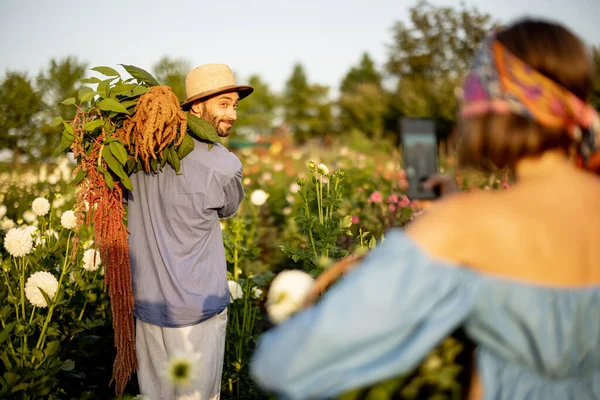 Man Woman Take Photos Phone While Picking Flowers Flower Farm — Stockfoto