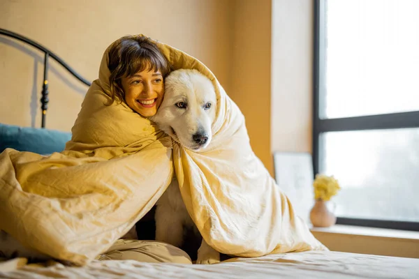 Cute Young Woman Hugs Her White Adorable Dog Covered Together — 스톡 사진