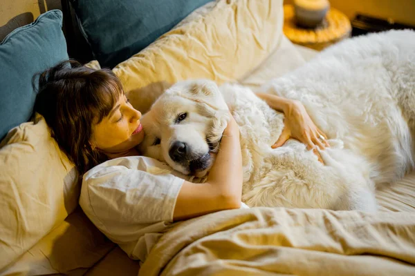 Woman Hugs Her Huge Cute Dog While Lying Together Bed — Photo