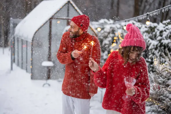 Man Woman Red Sweaters Celebrate New Years Holidays Lighting Sparklers — Stock Photo, Image