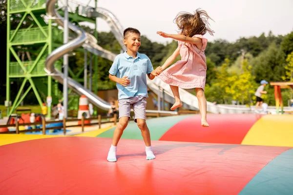 Kids Jumping Inflatable Trampoline Having Fun Visiting Amusement Park Summer — Stock Photo, Image