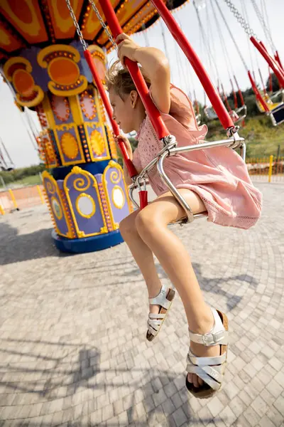 Kids Riding Colorful Amusement Carousel While Visiting Amusement Park Summer Stock Image