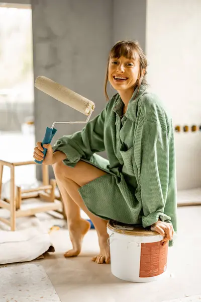 Portrait Young Cute Woman Sitting Paint Roller Bucket Full Paint Royalty Free Stock Photos