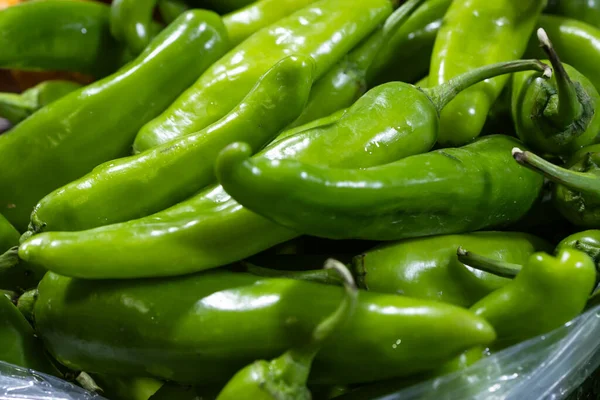 fresh organic green chilli at vegetable store for sale at evening